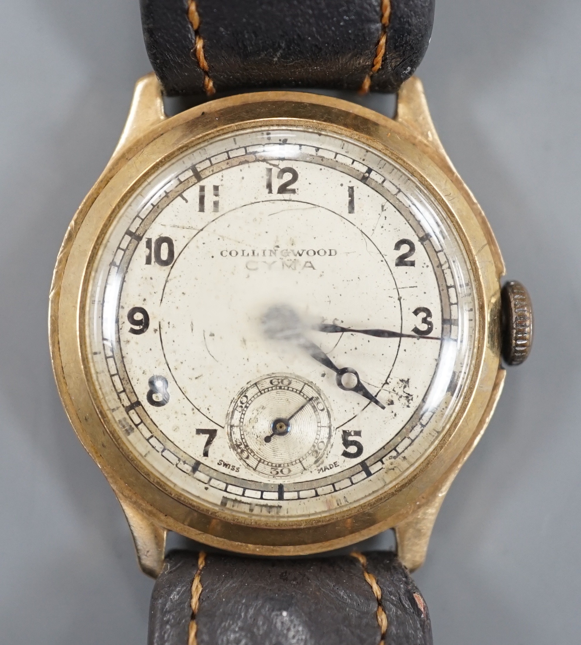 A gentleman's mid 20th century 9ct gold Cyma manual wind wrist watch, retailed by Collingwood, on associated? leather strap, case diameter 28mm.